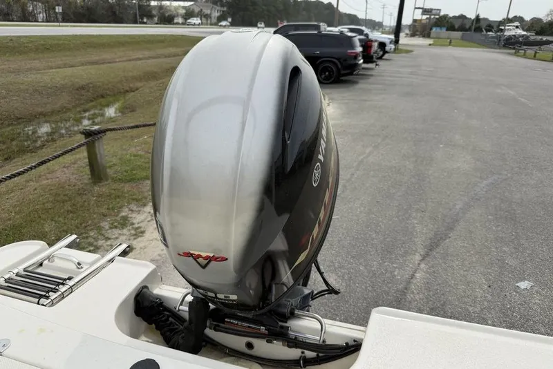 Slide: The Image of 2023 Stingray 173 CC boat with Yamaha outboard motor in a parking area. - 16