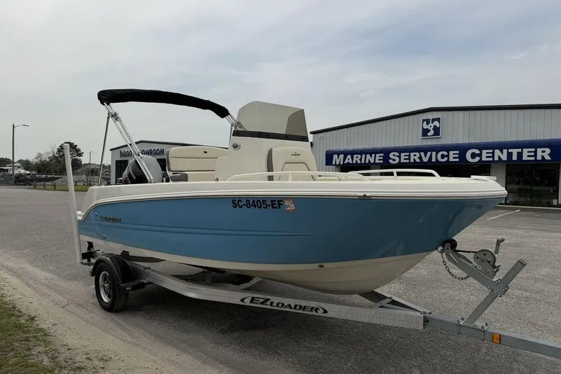Slide: The Image of 2023 Stingray 173 CC boat on trailer outside Marine Service Center. - 3