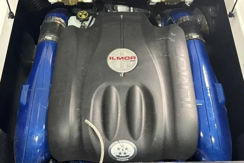 Slide: The Image of 2019 MasterCraft XT22 Ilmor engine with blue accents, top view. - 12