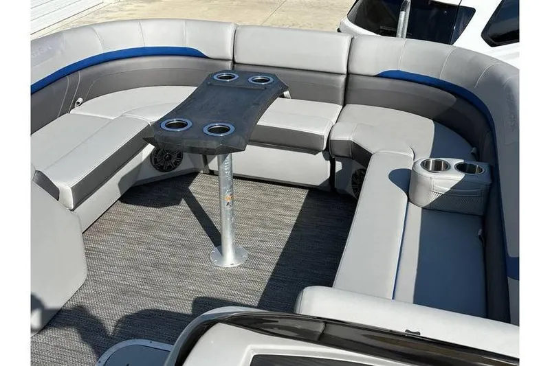 Slide: The Image of Luxurious seating area on 2022 Bennington 24 SXSR Quad Bench Tritoon boat. - 14