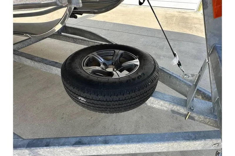 Slide: The Image of Spare tire on trailer for 2022 Bennington 24 SXSR Quad Bench Tritoon. - 17