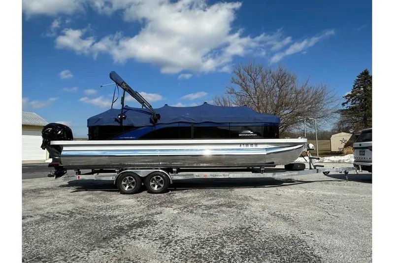 Slide: The Image of 2022 Bennington 24 SXSR Quad Bench Tritoon with Yamaha Vmax 250 SHO on trailer. - 3