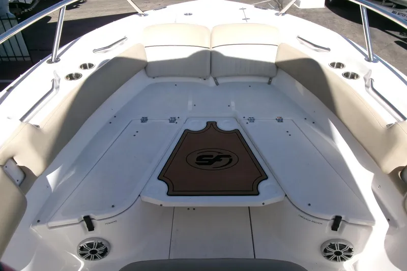Slide: The Image of 2018 Sea Fox 248 Commander boat interior with cushioned seating and cup holders. - 10