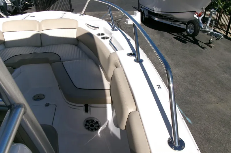 Slide: The Image of 2018 Sea Fox 248 Commander boat interior with cushioned seating and stainless steel railings. - 12