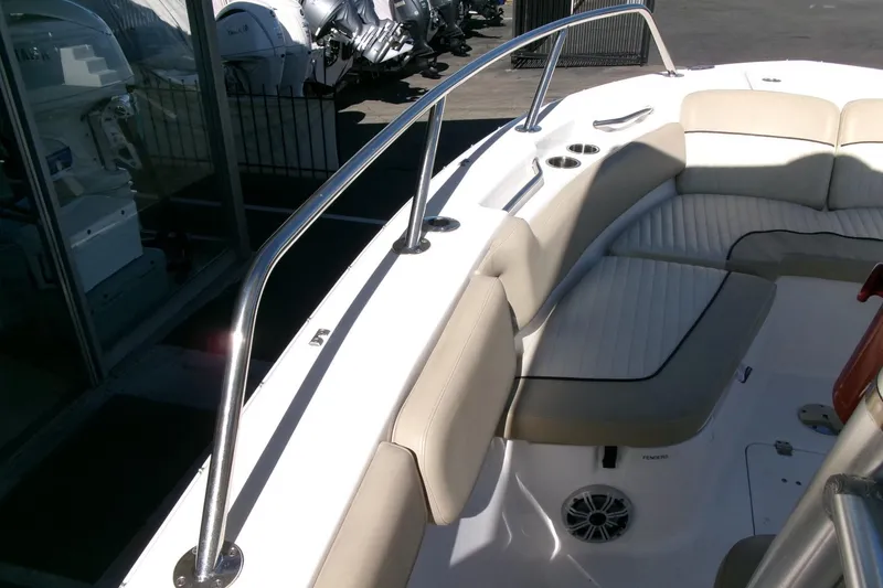 Slide: The Image of 2018 Sea Fox 248 Commander boat interior with cushioned seating and stainless steel railings. - 13