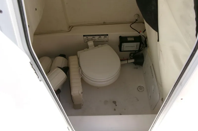 Slide: The Image of 2018 Sea Fox 248 Commander boat interior with toilet and storage area. - 18