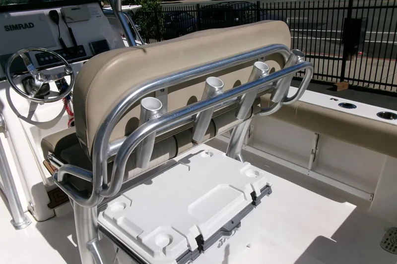 Slide: The Image of 2018 Sea Fox 248 Commander boat interior with rod holders and cooler. - 25