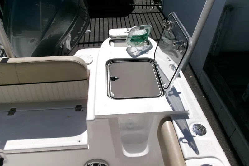 Slide: The Image of 2018 Sea Fox 248 Commander boat interior with seating and storage compartments. - 30