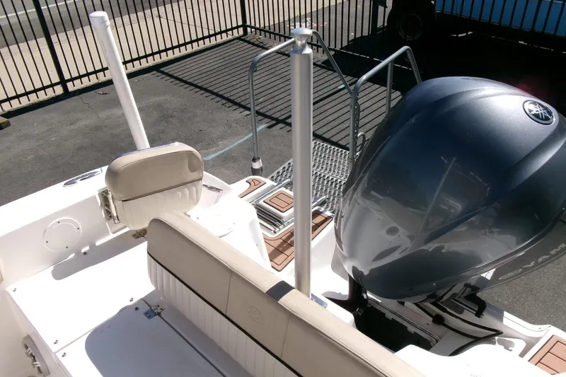 Slide: The Image of 2018 Sea Fox 248 Commander boat with Yamaha outboard engine, beige seating, and deck view. - 31