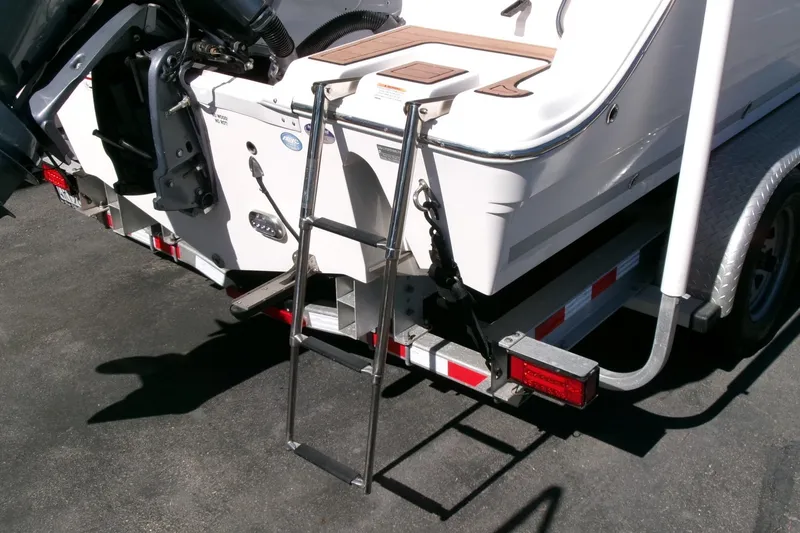 Slide: The Image of Rear view of 2018 Sea Fox 248 Commander boat with ladder and trailer. - 33