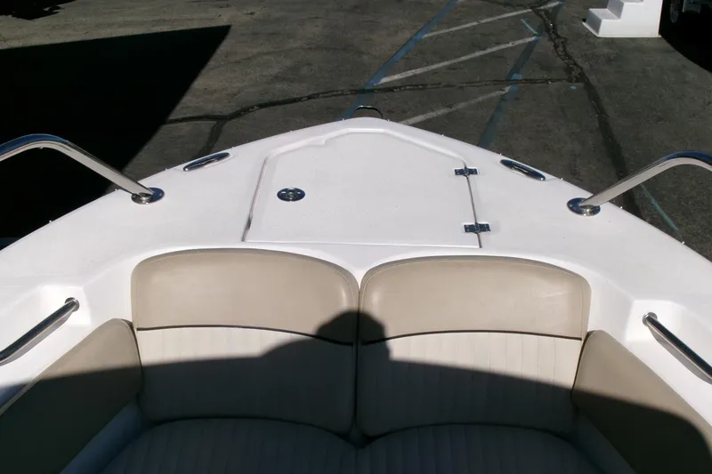 Slide: The Image of Bow seating area of a 2018 Sea Fox 248 Commander boat with beige cushions. - 4