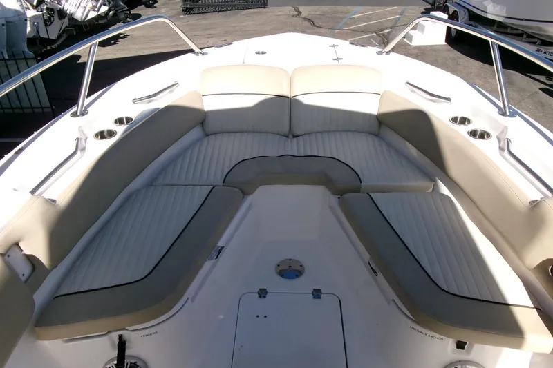 Slide: The Image of 2018 Sea Fox 248 Commander boat interior with cushioned seating and cup holders. - 6