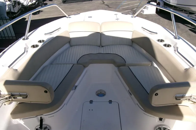 Slide: The Image of 2018 Sea Fox 248 Commander boat interior with cushioned seating and cup holders. - 7