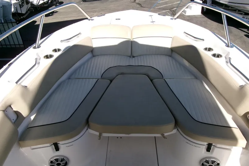 Slide: The Image of 2018 Sea Fox 248 Commander boat interior with cushioned seating and cup holders. - 9