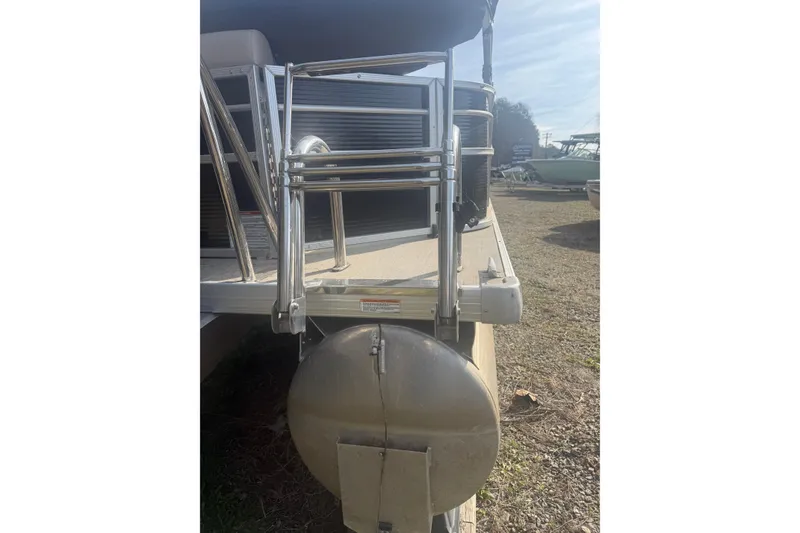 Slide: The Image of 2020 Princecraft Vectra 23 pontoon boat rear view with ladder and propeller. - 14