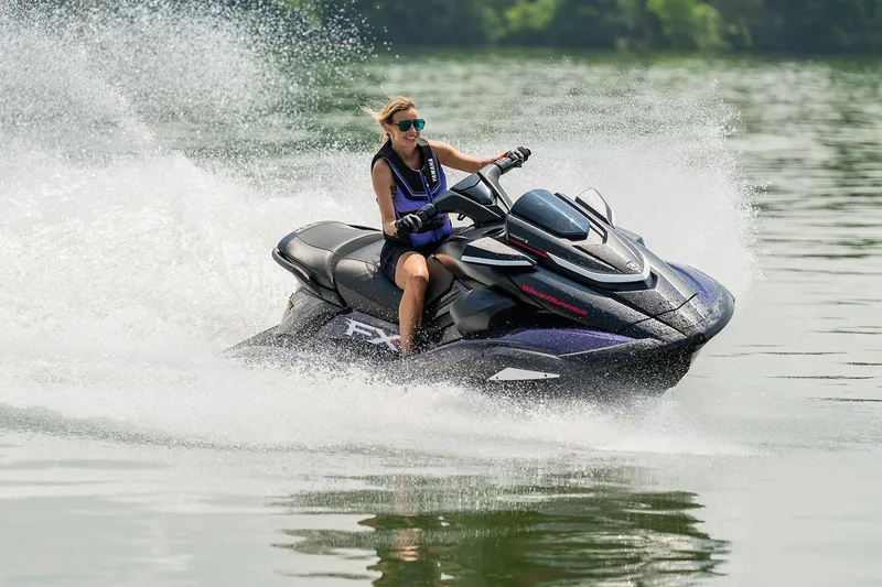 Slide: The Image of Manufacturer Provided Image: 2026 Yamaha WaveRunner FX SVHO jet ski speeding on a lake with a rider. - 16