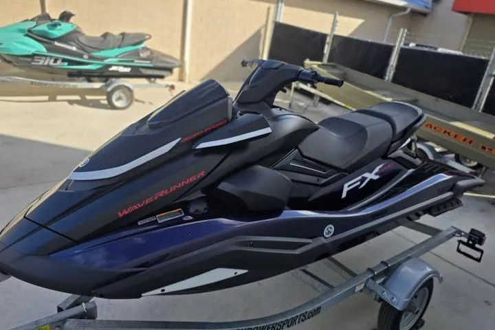 Slide: The Image of 2026 Yamaha WaveRunner FX SVHO jet ski on a trailer, sleek design, outdoor setting. - 2