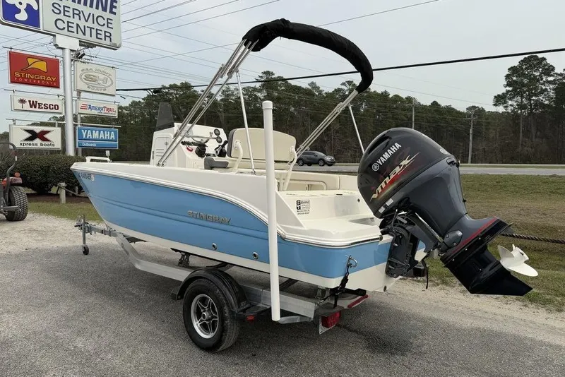 Slide: The Image of 2004 Robalo R260 Center Console boat on trailer with Yamaha outboard motor. - 3