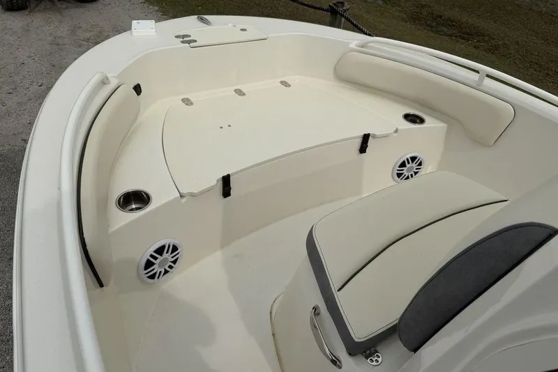 Slide: The Image of 2004 Robalo R260 Center Console boat interior with seating and storage compartments. - 7
