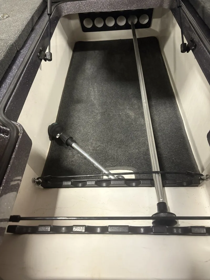 Slide: The Image of Interior of a 2011 Ranger 620 VS boat with storage compartment. - 27