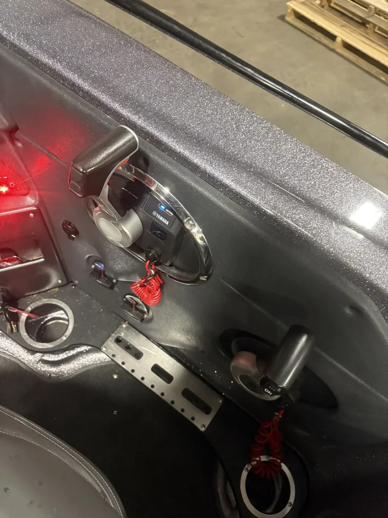 Slide: The Image of Interior view of a 2011 Ranger 620 VS boat with controls. - 38