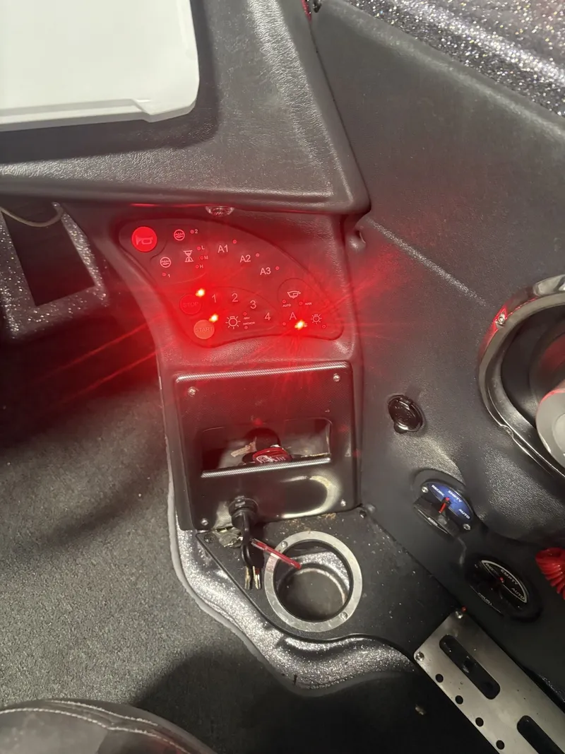Slide: The Image of Dashboard of a 2011 Ranger 620 VS with illuminated control lights. - 40