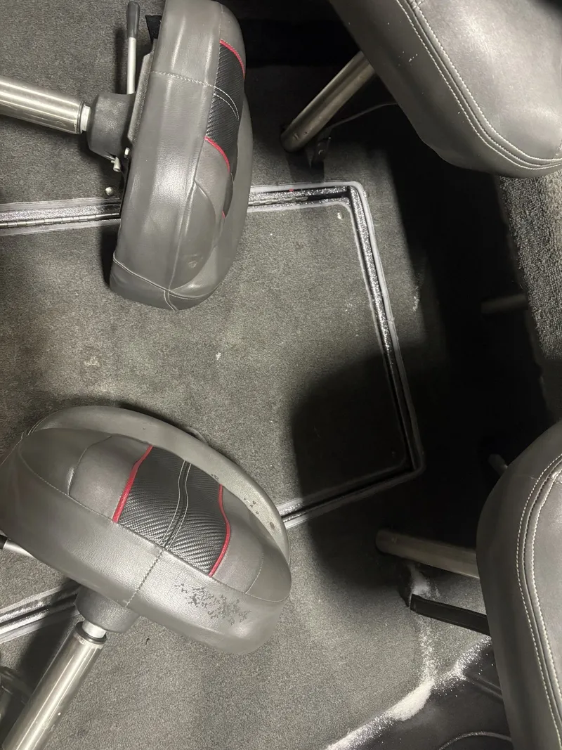 Slide: The Image of Interior of a 2011 Ranger 620 VS boat with gray seats. - 42