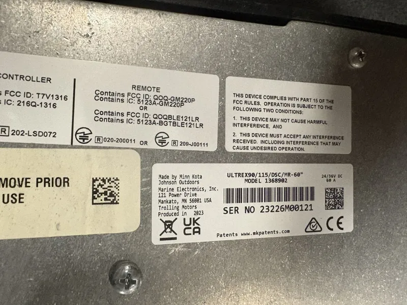 Slide: The Image of Close-up of compliance labels on electronic device. - 49