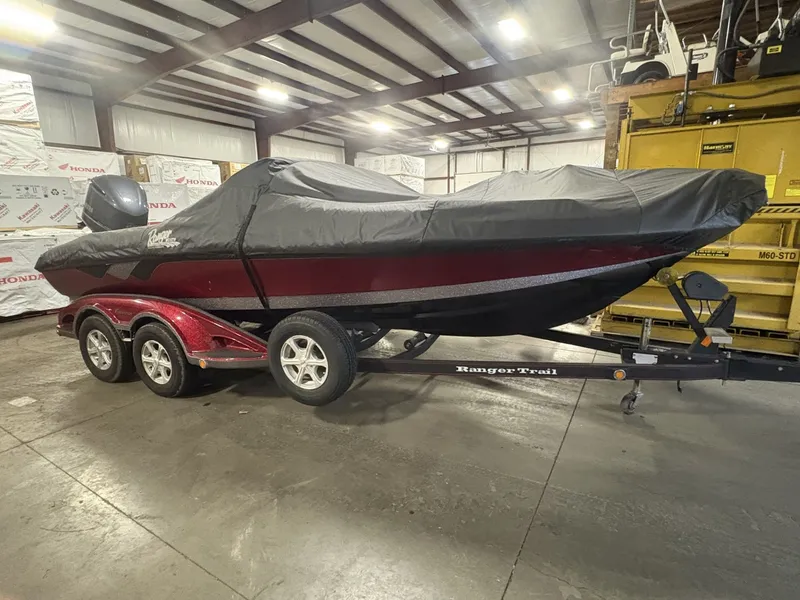 Slide: The Image of 2011 Ranger 620 VS boat with cover in warehouse. - 8