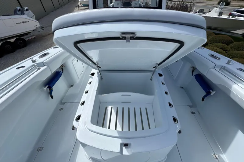 Slide: The Image of 2026 Yellowfin 36 Offshore boat with open storage compartment, showcasing spacious interior design. - 13
