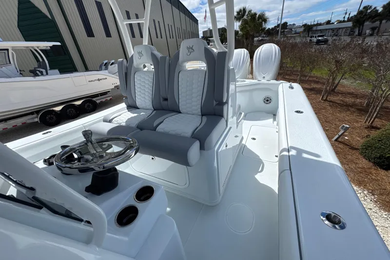 Slide: The Image of 2026 Yellowfin 36 Offshore boat interior with dual seats and steering wheel. - 17