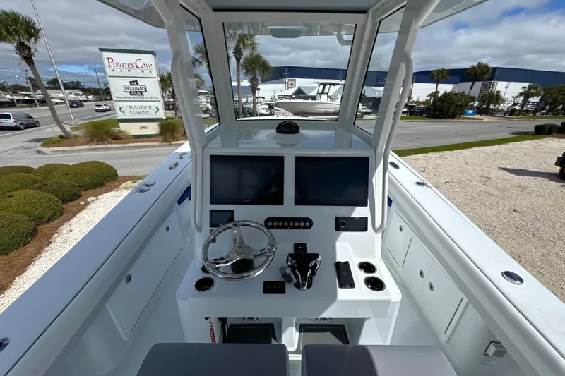 Slide: The Image of 2026 Yellowfin 36 Offshore boat console with dual screens at Pirates Cove Marina. - 18