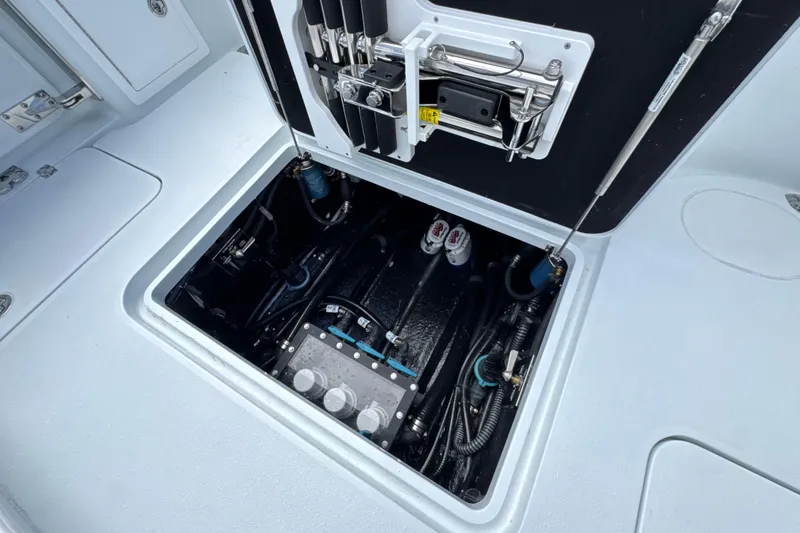 Slide: The Image of 2026 Yellowfin 36 Offshore boat compartment showcasing internal wiring and components. - 24