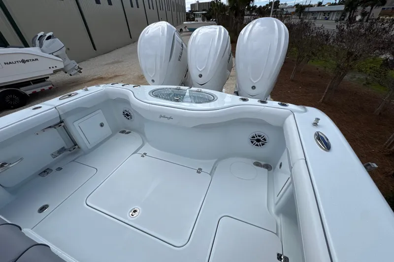 Slide: The Image of 2026 Yellowfin 36 Offshore boat with triple outboard engines, spacious deck, and sleek design. - 25