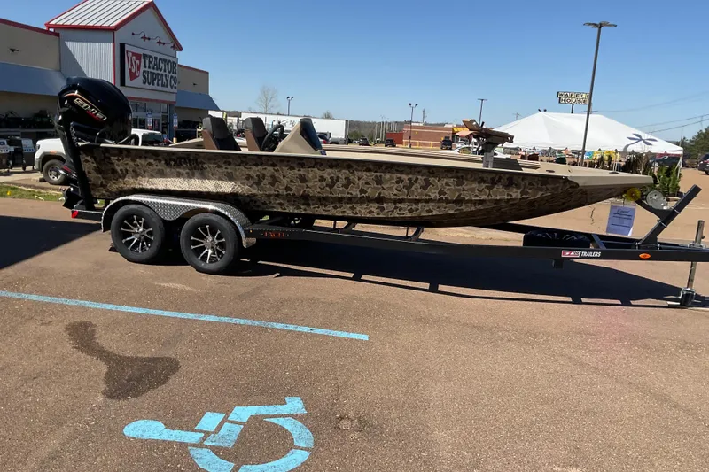 The Image of 2026 Excel EX 203 boat on trailer, parked outside Tractor Supply Co. - 0
