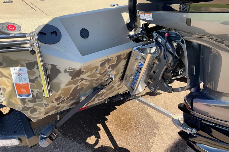 Slide: The Image of 2026 Excel EX 203 boat with camouflage design and motor mount detail. - 7