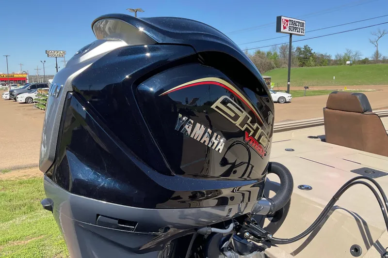 Slide: The Image of ```markdown Yamaha VMAX outboard motor on Excel EX 203 boat, 2026 model, in a parking lot. ``` - 8