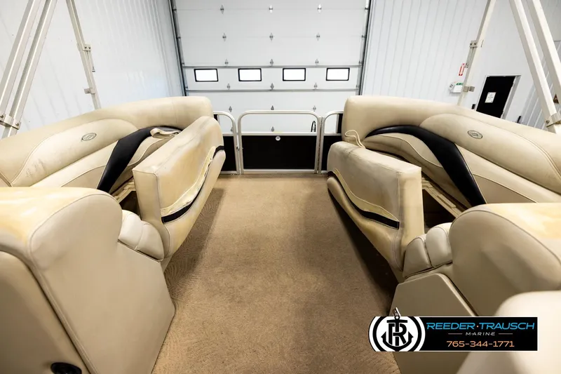 Slide: The Image of Interior of a 2011 Godfrey SW2486 boat with beige seating and carpet. - 19