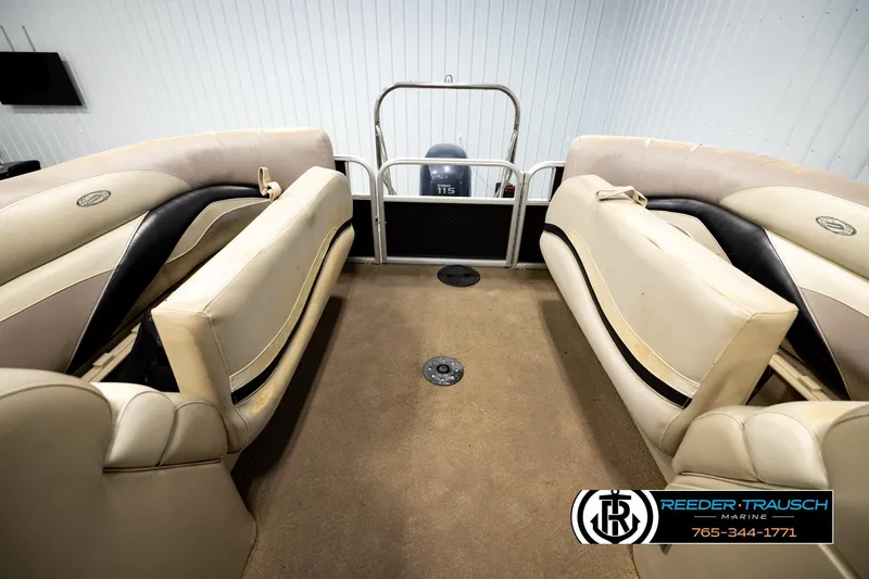 Slide: The Image of Interior of a 2011 Godfrey SW2486 boat with beige seating and carpet. - 27