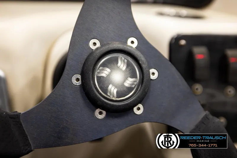 Slide: The Image of Close-up of a Godfrey sw2486 steering wheel, 2011 model, with Reeder-Trausch Marine logo. - 30