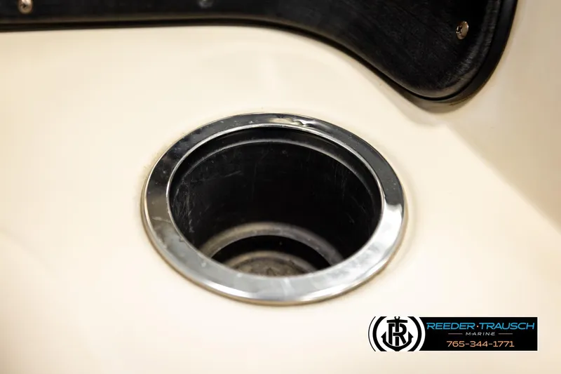 Slide: The Image of Cup holder on a 2011 Godfrey SW2486 boat, Reeder-Trausch Marine branding visible. - 33