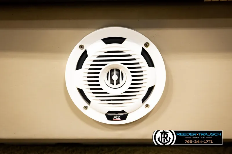 Slide: The Image of White speaker on a 2011 Godfrey SW2486 boat, Reeder-Trausch Marine branding visible. - 39