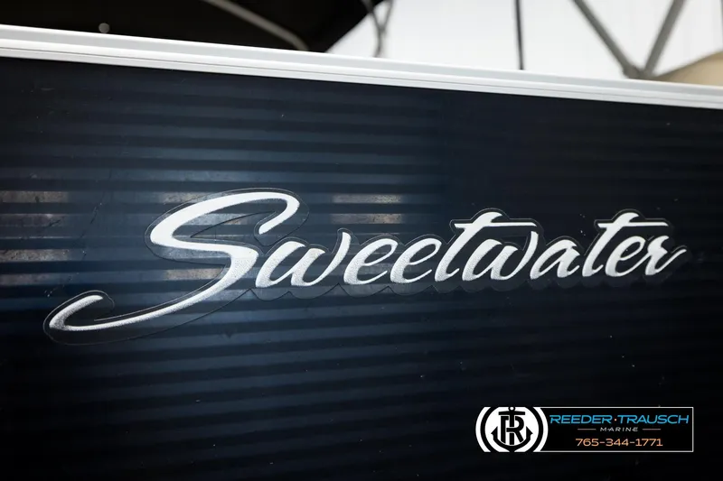 Slide: The Image of Sweetwater logo on 2011 Godfrey SW2486 boat, Reeder-Trausch Marine branding visible. - 44