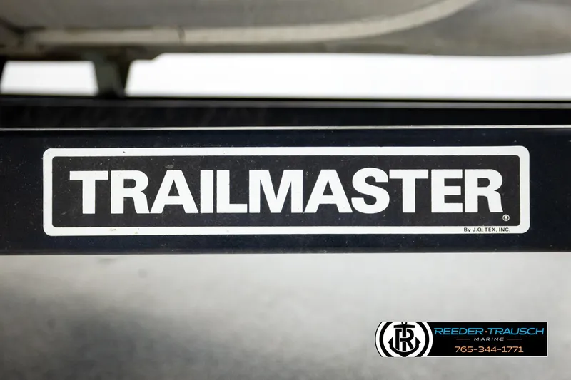 Slide: The Image of Trailmaster logo on Godfrey sw2486, 2011 model, with Reeder-Trausch Marine contact details. - 46