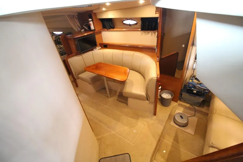 Slide: The Image of Helm of 2004 Cruisers Yachts 320 Express with Garmin navigation system and wood-accented steering wheel. - 11
