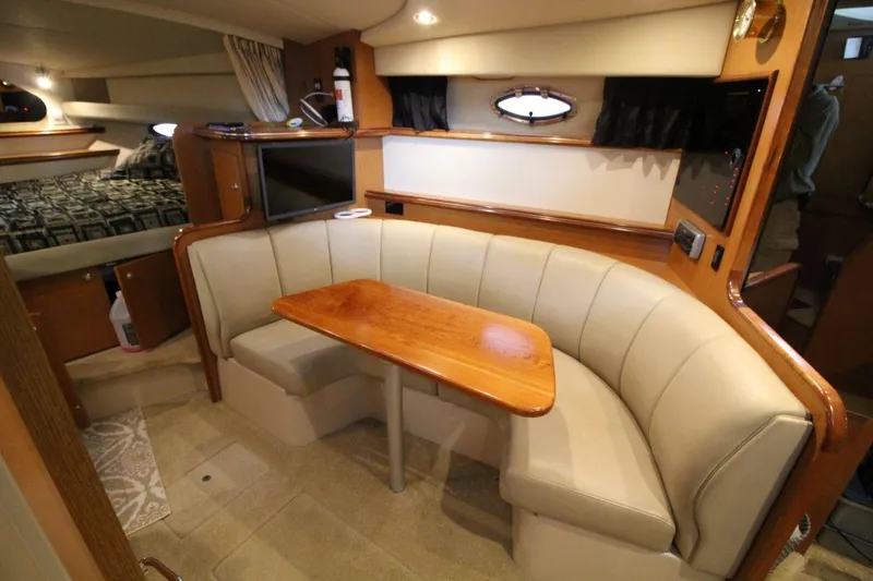 Slide: The Image of 2004 Cruisers Yachts 320 Express docked in marina, top deck view. - 12