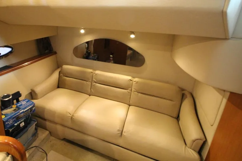 Slide: The Image of 2004 Cruisers Yachts 320 Express boat docked in marina, featuring enclosed cockpit. - 13