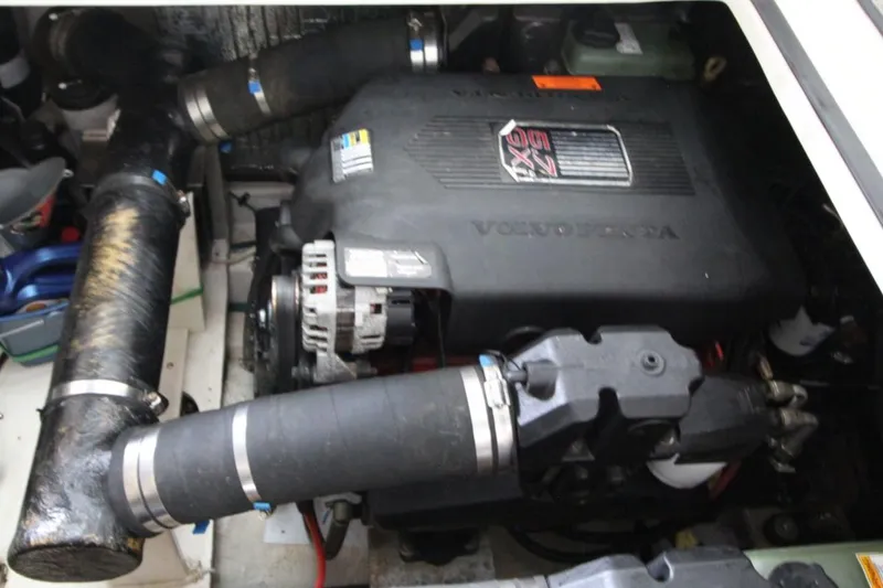 Slide: The Image of Engine compartment of 2004 Cruisers Yachts 320 Express with visible Volvo Penta components. - 22