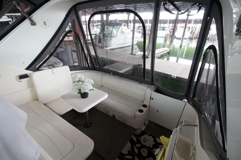 Slide: The Image of 2004 Cruisers Yachts 320 Express docked in marina, front view. - 5