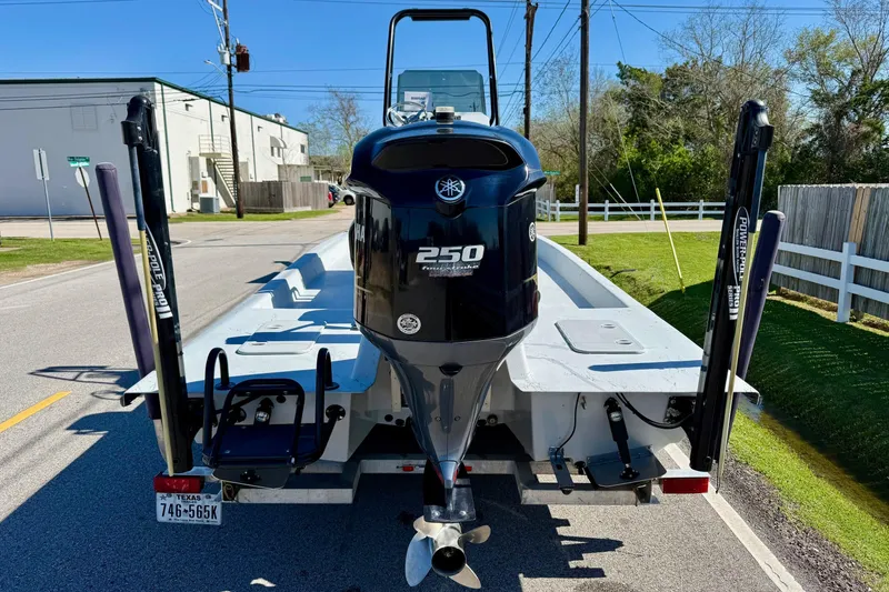 Slide: The Image of JH Performance boat with Yamaha 250 engine, parked on a street, Texas license plate visible. - 3